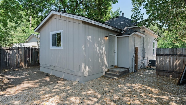 219 14th Ave N, Nampa, ID 83687 - view of side of property with crawl space, a shingled roof, and cooling unit
