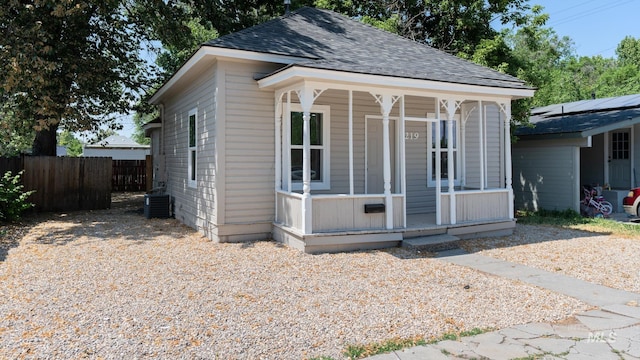 219 14th Ave N, Nampa, ID 83687 - view of front of home with roof with shingles, central AC unit, and covered porch