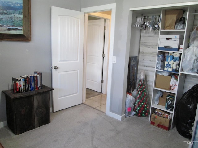 bedroom with carpet floors and baseboards