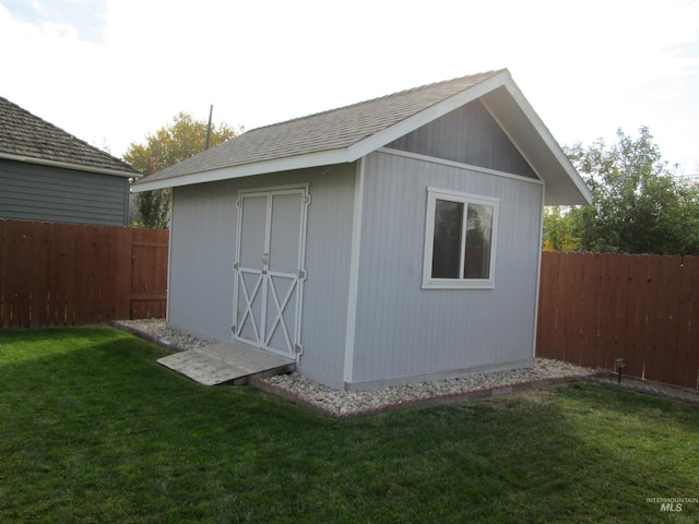 view of shed featuring a fenced backyard