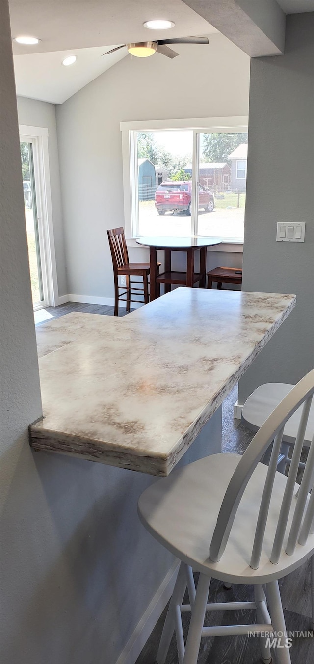 dining area with vaulted ceiling