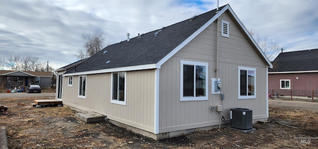 back of property with central AC