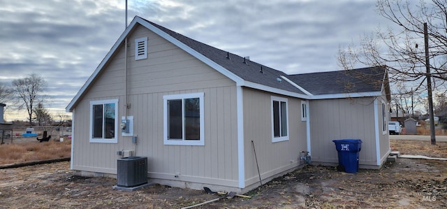 view of side of property with central AC