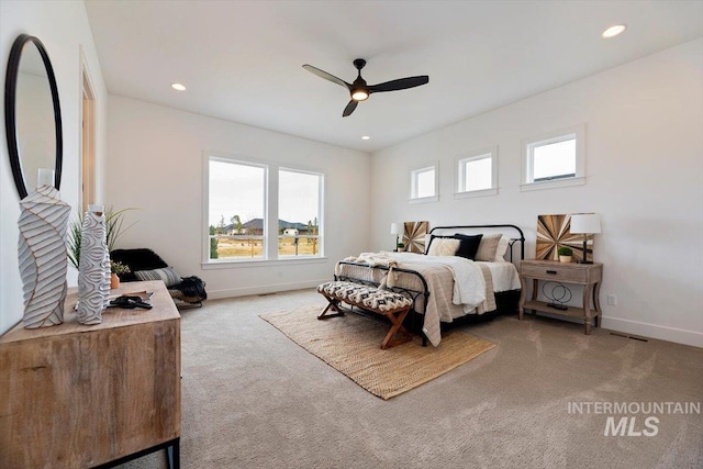 carpeted bedroom featuring ceiling fan