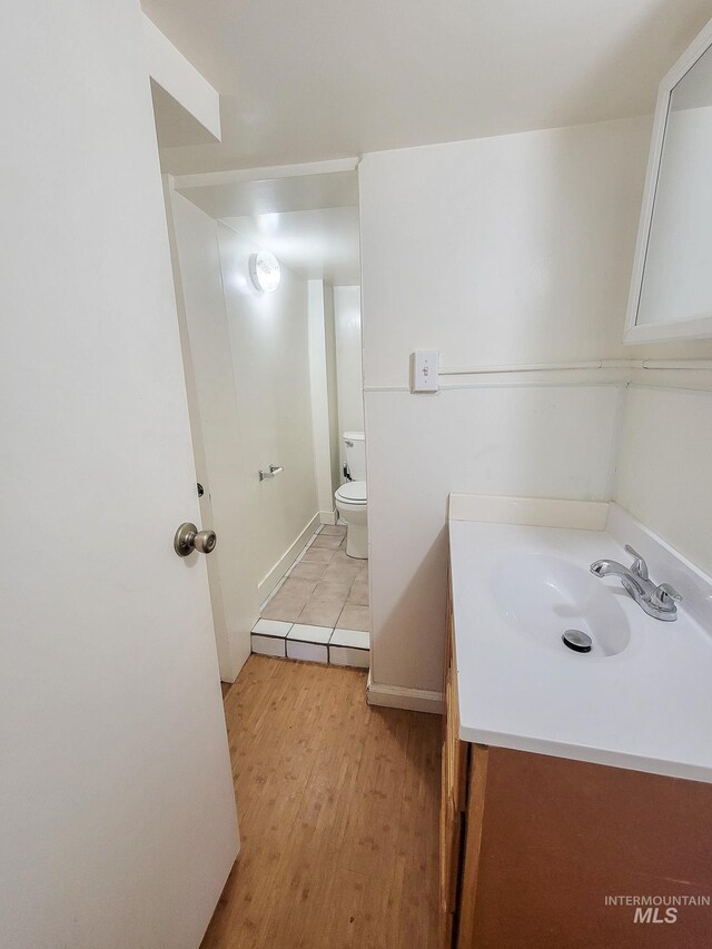 1603 11th Ave, Lewiston, ID 83501 - half bath with wood finished floors, vanity, and toilet