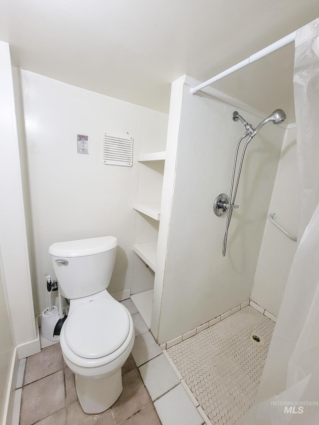 1603 11th Ave, Lewiston, ID 83501 - full bath with a shower with curtain, toilet, and tile patterned floors