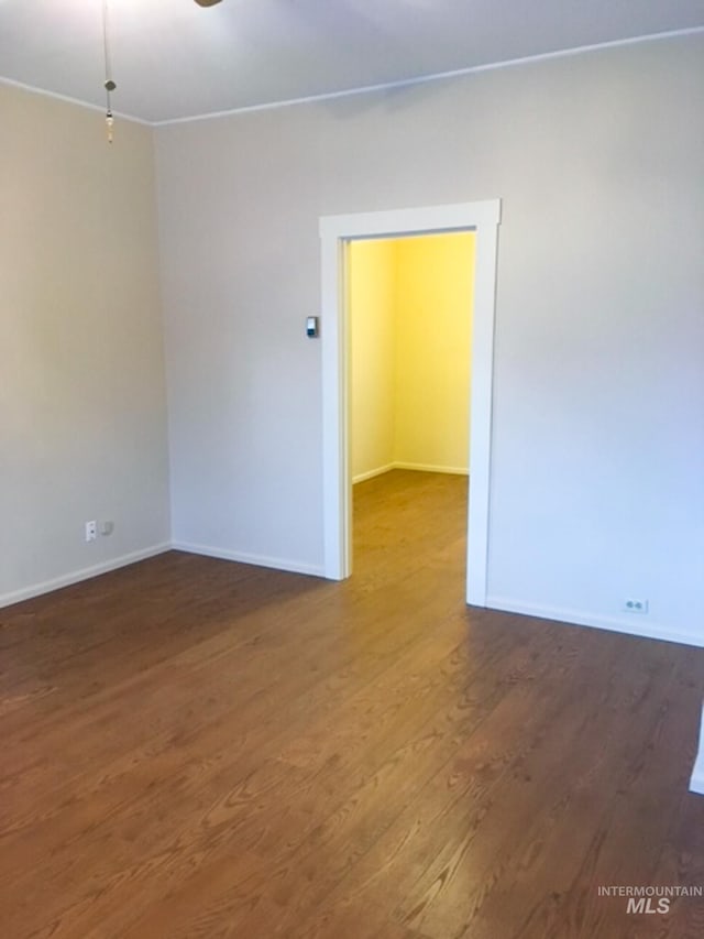 1603 11th Ave, Lewiston, ID 83501 - empty room featuring wood finished floors, baseboards, and crown molding