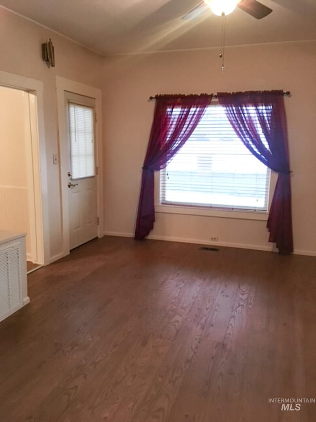 1603 11th Ave, Lewiston, ID 83501 - empty room featuring ceiling fan, dark wood finished floors, and baseboards