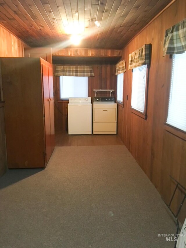 1603 11th Ave, Lewiston, ID 83501 - clothes washing area featuring washer and clothes dryer, wooden walls, and wood ceiling