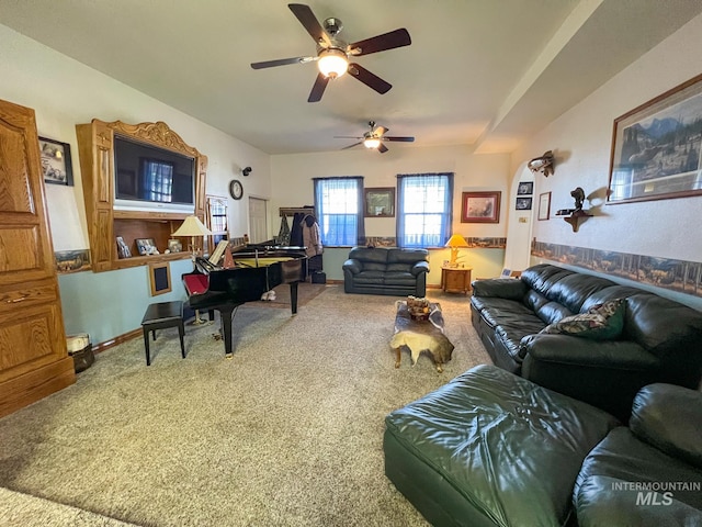 carpeted living room with ceiling fan