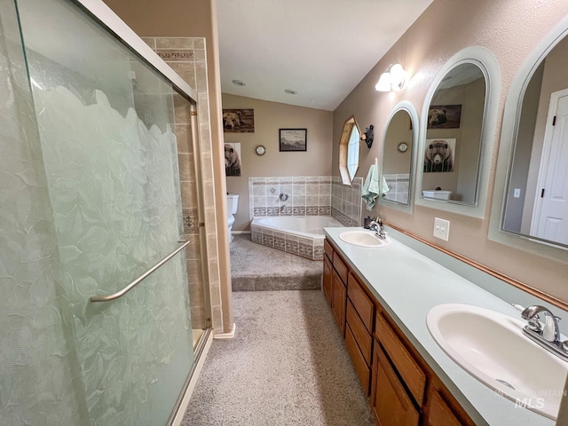 full bathroom featuring independent shower and bath, vanity, toilet, and lofted ceiling