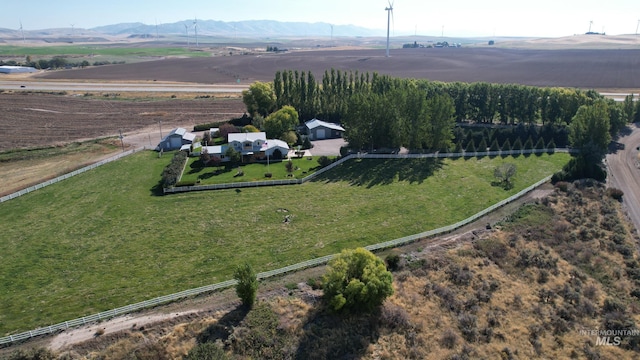 birds eye view of property featuring a mountain view and a rural view