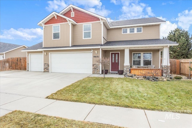 craftsman-style home with stone siding, fence, and a porch