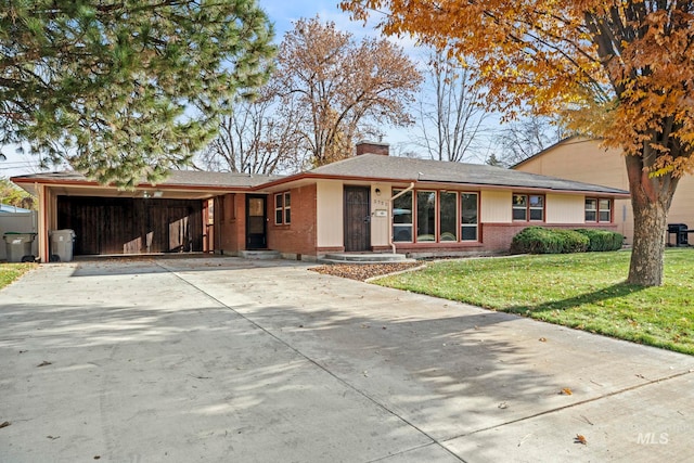 view of front of house with a front yard and a carport