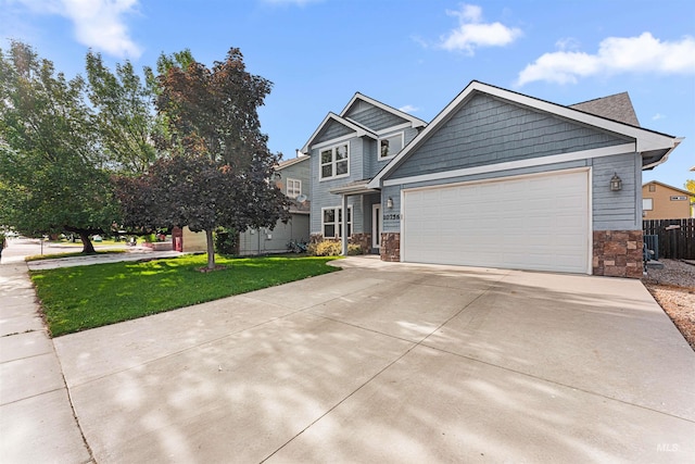 craftsman-style house featuring stone siding, concrete driveway, and an attached garage