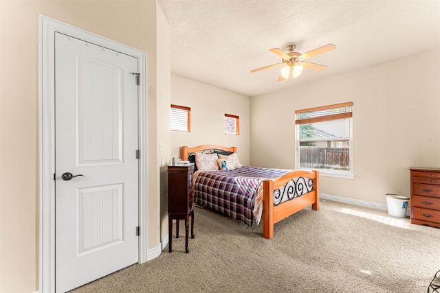 bedroom with carpet, baseboards, and ceiling fan