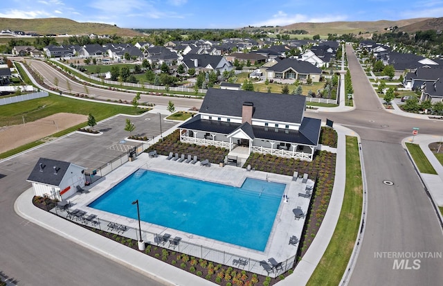 drone / aerial view with a mountain view and a residential view