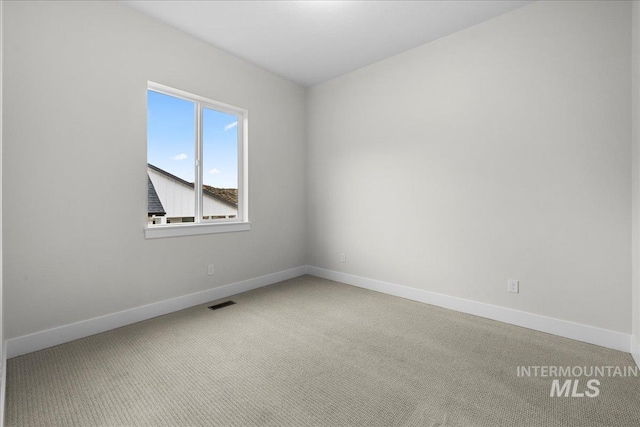 unfurnished room with carpet flooring