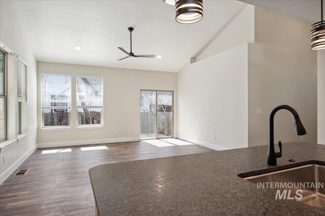 701 N 2nd Ave, Hailey, ID 83333 - unfurnished living room featuring plenty of natural light, a sink, a ceiling fan, and visible vents