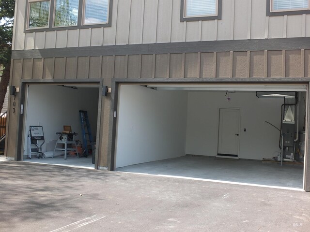 701 N 2nd Ave, Hailey, ID 83333 - garage featuring heating unit and driveway