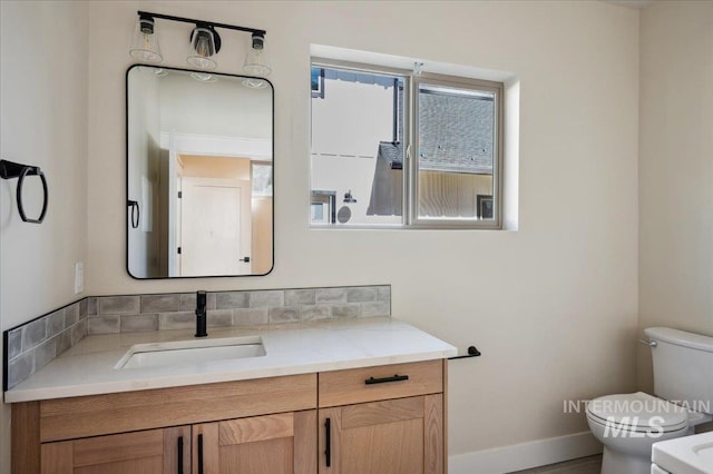 701 N 2nd Ave, Hailey, ID 83333 - bathroom featuring baseboards, toilet, and vanity