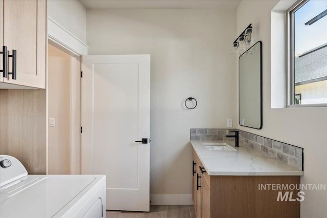 701 N 2nd Ave, Hailey, ID 83333 - bathroom with vanity, baseboards, and washer / clothes dryer