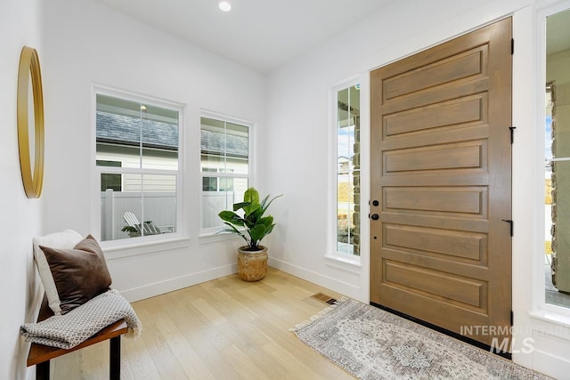 foyer with light wood-type flooring