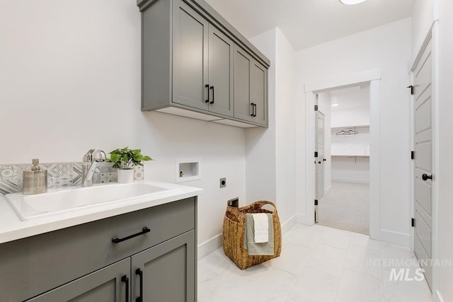 washroom featuring cabinets, light carpet, electric dryer hookup, sink, and hookup for a washing machine