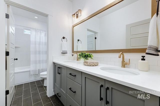 full bathroom with backsplash, toilet, vanity, and shower / bath combination with curtain