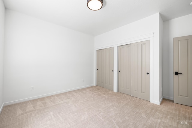 2206 N 20th, Boise, ID 83702 - unfurnished bedroom featuring carpet flooring and two closets