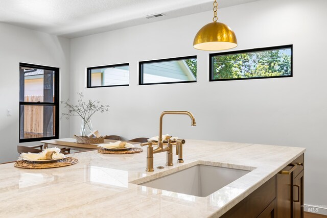 2206 N 20th, Boise, ID 83702 - kitchen with light stone counters and pendant lighting