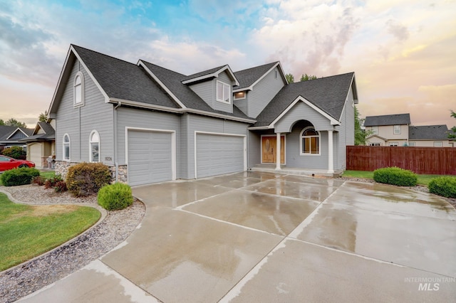 10224 W Altair, Star, ID 83669 - traditional-style house featuring roof with shingles, a garage, and driveway