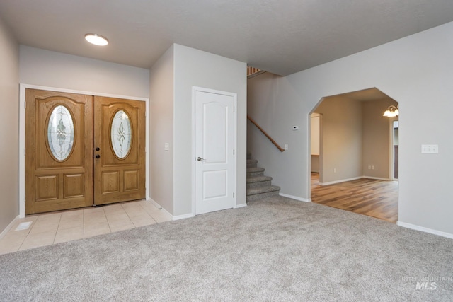10224 W Altair, Star, ID 83669 - carpeted foyer with arched walkways and stairway