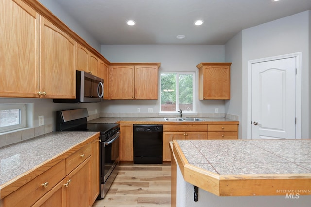 10224 W Altair, Star, ID 83669 - kitchen featuring black dishwasher, range with electric cooktop, light wood-style flooring, stainless steel microwave, and recessed lighting