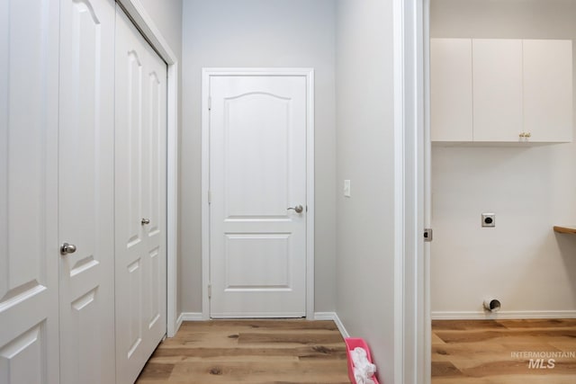 10224 W Altair, Star, ID 83669 - laundry room featuring hookup for an electric dryer, light wood-style floors, and cabinet space