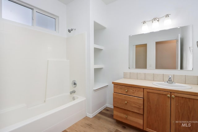 10224 W Altair, Star, ID 83669 - bathroom featuring vanity, wood finished floors, and shower / washtub combination