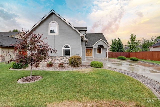 10224 W Altair, Star, ID 83669 - view of front of home featuring a shingled roof, stone siding, and driveway