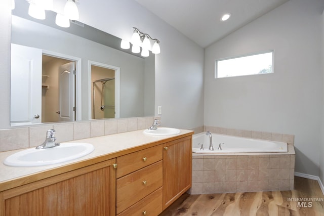 10224 W Altair, Star, ID 83669 - full bath with double vanity, wood finished floors, a bath, and lofted ceiling