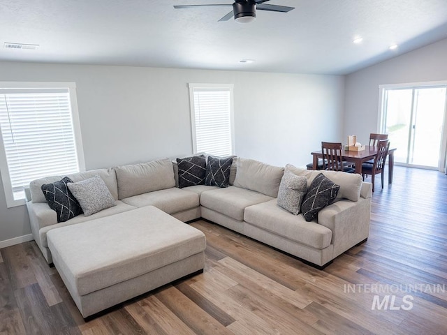 13743 S Sonata Way, Nampa, ID 83651 - living area with wood finished floors, ceiling fan, lofted ceiling, and baseboards