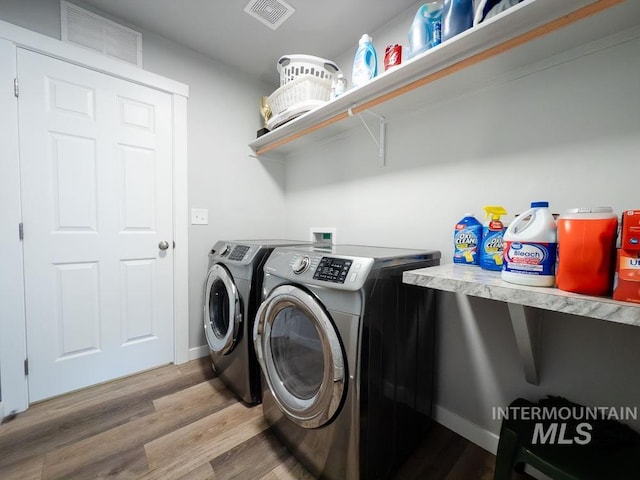 13743 S Sonata Way, Nampa, ID 83651 - laundry room featuring washer and dryer and wood finished floors