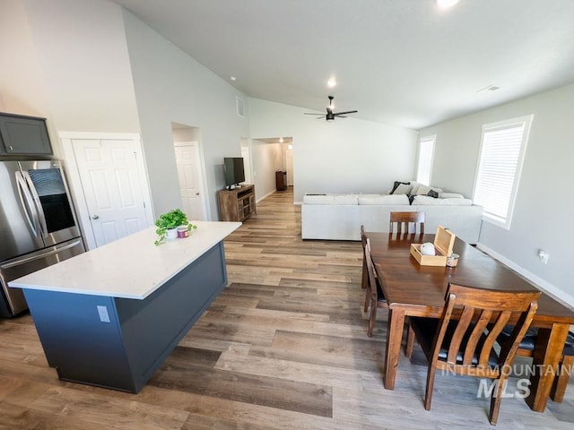 13743 S Sonata Way, Nampa, ID 83651 - dining area with ceiling fan, wood finished floors, high vaulted ceiling, and recessed lighting