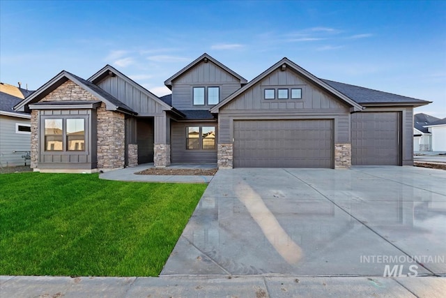 craftsman-style home with a garage and a front yard