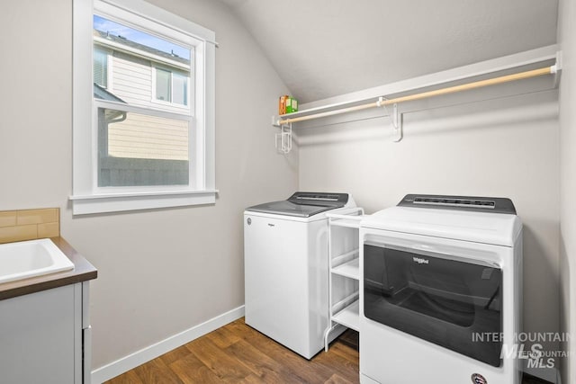 4672 N Patimos Ave, Meridian, ID 83646 - laundry room with washing machine and dryer, dark wood-type flooring, and baseboards