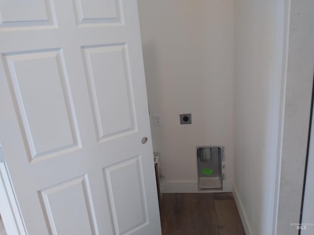 laundry room with hookup for an electric dryer and dark wood-type flooring