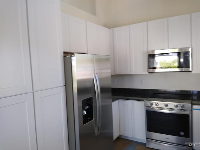 kitchen with white cabinetry and stainless steel appliances