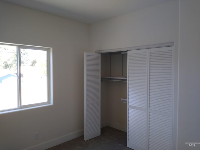 unfurnished bedroom with a closet