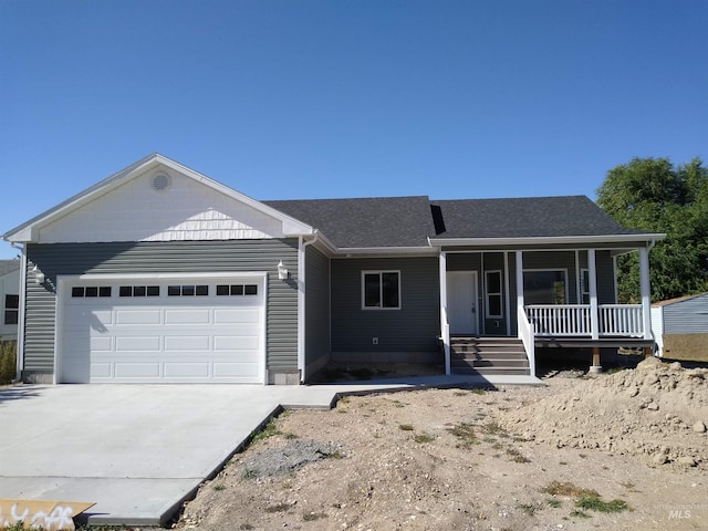 ranch-style house with a porch and a garage