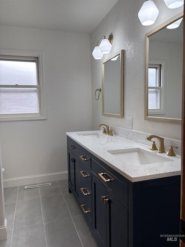 1715 S 10th Ave, Caldwell, ID 83605 - full bathroom featuring double vanity and tile patterned flooring