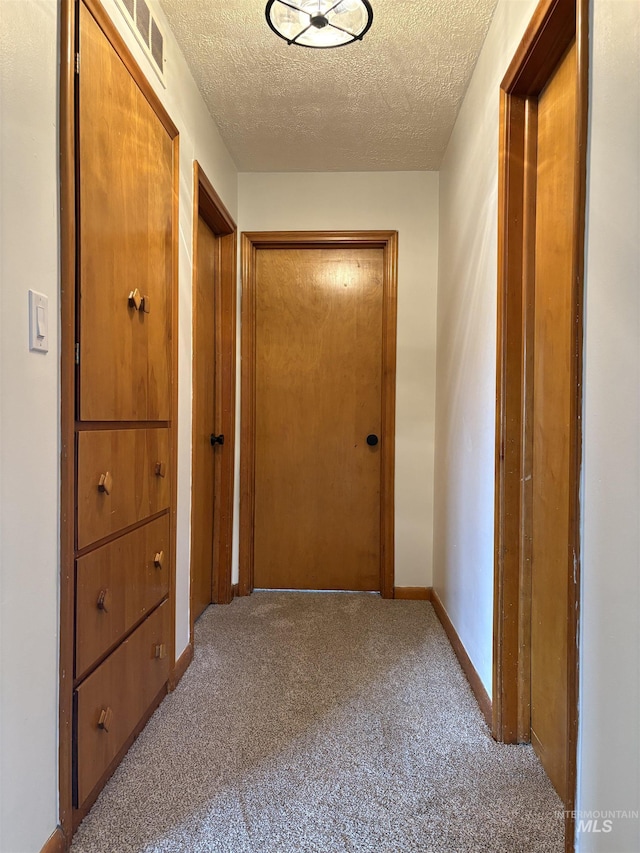 1715 S 10th Ave, Caldwell, ID 83605 - hall featuring carpet and a textured ceiling