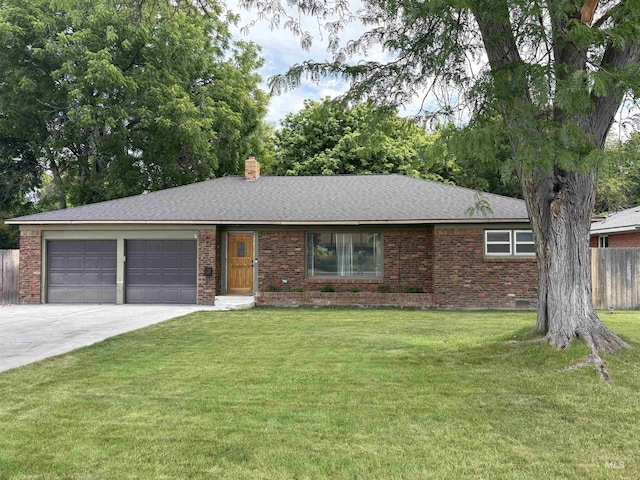 1715 S 10th Ave, Caldwell, ID 83605 - single story home featuring a garage, concrete driveway, brick siding, and a chimney